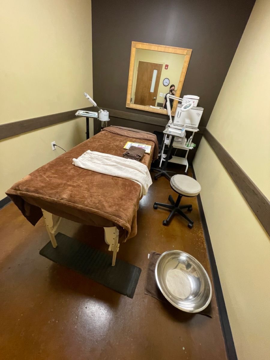 Facial room with treatment table and skincare equipment